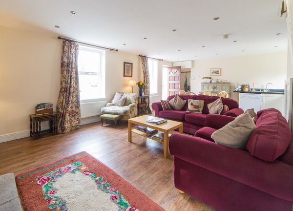 Riding Farm Cottage open plan lounge with wood burning stove 